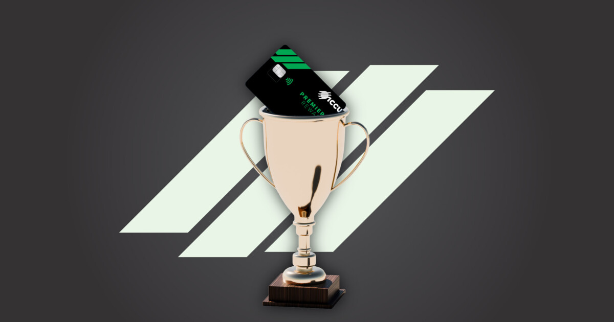 An ICCU Premier Rewards credit card inside a trophy, which symbolizes its rewards.
