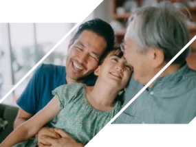 A man and girl laugh with an elderly man.