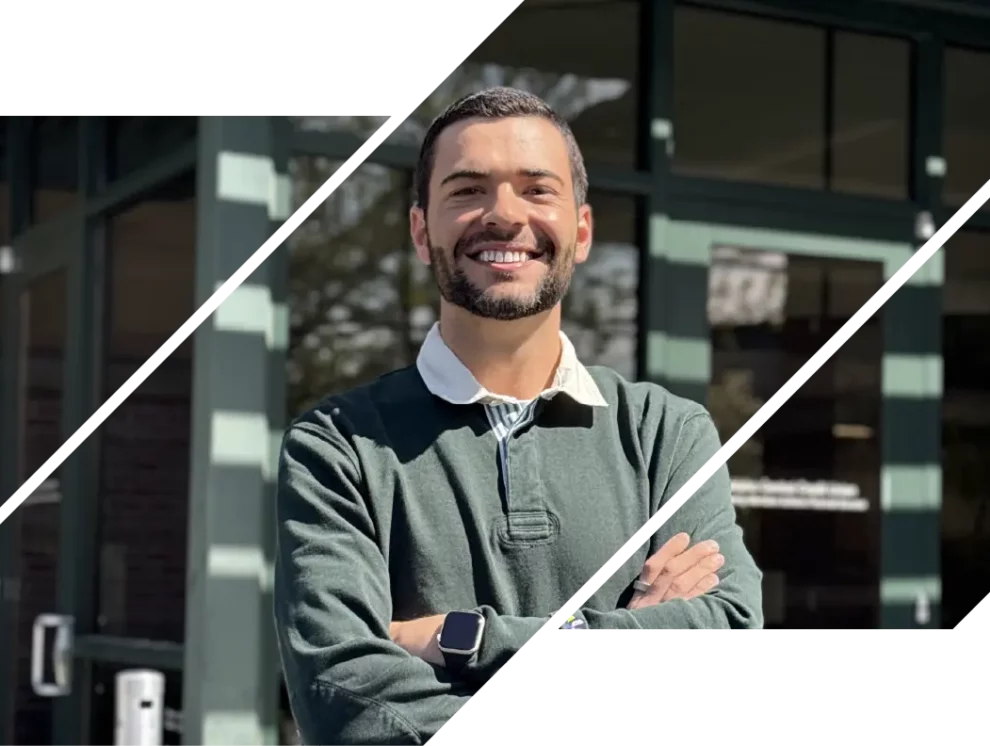 A picture of Darian Miles, an aficionado in financial literacy, crossing his arms and smiling at the camera.