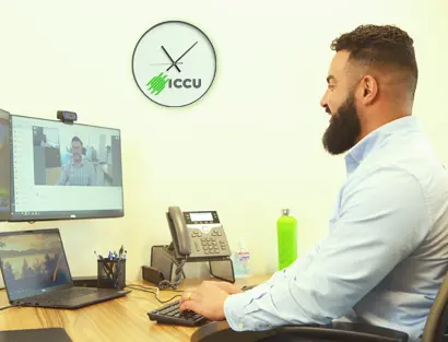 Man talking with someone on his computer