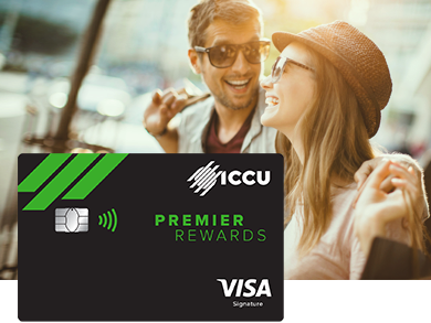 A couple smiling while shopping with an ICCU credit card