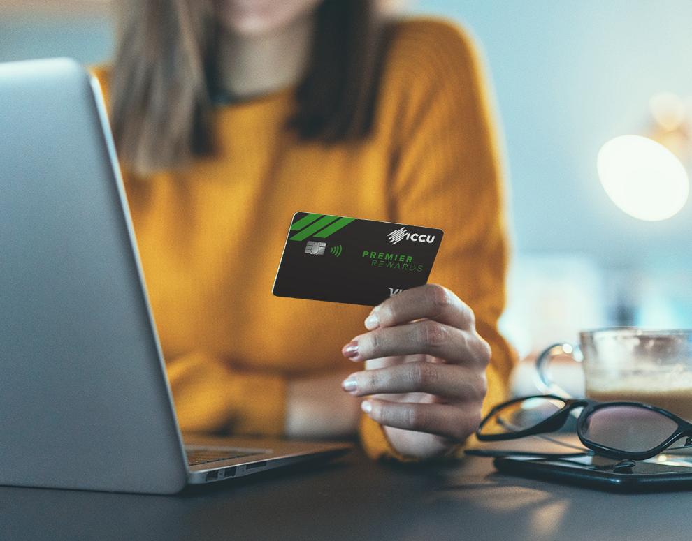 women holding her ICCU credit card